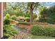 Beautifully landscaped backyard garden featuring tiered plantings and stonework at 2324 Littlebrooke Ln, Dunwoody, GA 30338