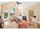 Bright living room featuring a fireplace, built-in shelving, and oversized windows that let in natural light at 2324 Littlebrooke Ln, Dunwoody, GA 30338
