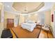Main bedroom with large windows, trey ceilings, and carpeted rug and hardwood floors, offering a serene retreat at 2324 Littlebrooke Ln, Dunwoody, GA 30338