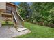 Backyard view highlighting the home's deck access, well-maintained lawn, and the bordering fence at 310 Medridge Dr, Alpharetta, GA 30022
