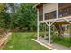Inviting backyard with a lush green lawn, a charming fence, and a view of the home's deck at 310 Medridge Dr, Alpharetta, GA 30022