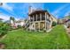 Spacious backyard featuring a well-maintained lawn and a deck, perfect for outdoor activities and relaxation at 310 Medridge Dr, Alpharetta, GA 30022