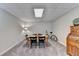 Finished basement area with a game table, chairs, and a bicycle at 310 Medridge Dr, Alpharetta, GA 30022