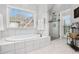 Luxurious bathroom featuring a soaking tub and a separate glass-enclosed shower at 310 Medridge Dr, Alpharetta, GA 30022