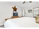 Bright bedroom with a large bed, television, and unique star decor at 310 Medridge Dr, Alpharetta, GA 30022