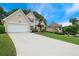 Beautiful home showcasing a long driveway and lush green lawn at 310 Medridge Dr, Alpharetta, GA 30022