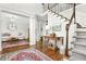 Welcoming foyer with hardwood floors, staircase, and elegant decor at 310 Medridge Dr, Alpharetta, GA 30022