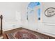 Bright foyer featuring hardwood floors, a white front door and classic trim at 310 Medridge Dr, Alpharetta, GA 30022
