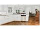 Modern kitchen showcases granite countertops, stainless steel appliances, and hardwood flooring at 310 Medridge Dr, Alpharetta, GA 30022