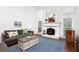 Spacious living room showcasing a fireplace, tall ceilings, and natural light at 310 Medridge Dr, Alpharetta, GA 30022