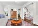 Inviting living room displaying hardwood floors and a glimpse of the staircase at 310 Medridge Dr, Alpharetta, GA 30022