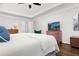 Bright main bedroom with hardwood floors, tray ceiling, and comfortable furnishings at 310 Medridge Dr, Alpharetta, GA 30022