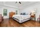 Spacious main bedroom featuring hardwood floors, a tray ceiling, and ample natural light at 310 Medridge Dr, Alpharetta, GA 30022