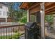 Outdoor living space, featuring a grill, a view of the backyard, and the screened porch at 310 Medridge Dr, Alpharetta, GA 30022