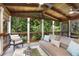 Relaxing screened porch with comfortable seating, offering serene views of the surrounding lush greenery at 310 Medridge Dr, Alpharetta, GA 30022