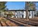 Back of house exterior with new wooden deck and freshly painted brick at 1120 Starline Se Dr, Smyrna, GA 30080
