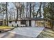 Charming single-story home with a modern painted brick facade and mature trees in a desirable neighborhood at 1120 Starline Se Dr, Smyrna, GA 30080