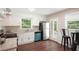 Bright kitchen with white cabinets, stainless steel appliances, and a view of the outdoor deck at 1120 Starline Se Dr, Smyrna, GA 30080