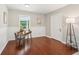 Functional living room space with hardwood floors, neutral walls, and a comfortable seating area at 1120 Starline Se Dr, Smyrna, GA 30080