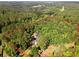 Aerial view of the property lines and surrounding wooded acreage at 1143 Mcgarity Rd, Mcdonough, GA 30252
