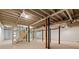 A partially finished basement with exposed beams and supports offers a flexible space at 1143 Mcgarity Rd, Mcdonough, GA 30252