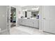 Bright bathroom featuring a double vanity, tile flooring, and ample storage space at 1143 Mcgarity Rd, Mcdonough, GA 30252
