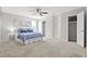 A spacious bedroom with a plush carpet and an adjacent closet offers plenty of storage at 1143 Mcgarity Rd, Mcdonough, GA 30252