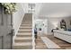 Bright entryway featuring a staircase and open access to the living room at 1143 Mcgarity Rd, Mcdonough, GA 30252