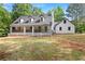 Charming two-story home with dormer windows and a spacious porch at 1143 Mcgarity Rd, Mcdonough, GA 30252