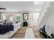 Inviting living room with a staircase, wood flooring, and abundant natural light at 1143 Mcgarity Rd, Mcdonough, GA 30252
