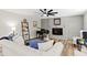 Cozy living room with a fireplace, piano, and comfortable seating at 1143 Mcgarity Rd, Mcdonough, GA 30252
