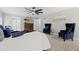Large main bedroom with plush chairs, stylish decor, and plenty of natural light at 1143 Mcgarity Rd, Mcdonough, GA 30252