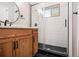 Renovated bathroom featuring a glass enclosed shower, hexagon tile and a modern vanity at 1336 Mcclelland Ave, Atlanta, GA 30344
