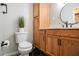 Updated bathroom with modern black fixtures, hexagonal tile flooring, and a wood vanity at 1336 Mcclelland Ave, Atlanta, GA 30344