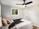 Comfortable bedroom with neutral tones, a ceiling fan, and a bright window at 1336 Mcclelland Ave, Atlanta, GA 30344