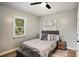 Serene bedroom with a plush bed, decorative pillows, and a tranquil atmosphere for rest and relaxation at 1336 Mcclelland Ave, Atlanta, GA 30344