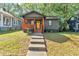Charming home with a welcoming porch, warm wood accents, and a sunny yellow front door at 1336 Mcclelland Ave, Atlanta, GA 30344