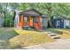 Charming home with a welcoming porch, warm wood accents, and a sunny yellow front door at 1336 Mcclelland Ave, Atlanta, GA 30344