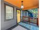 Inviting front porch features a stylish pendant light and a colorful welcome mat at 1336 Mcclelland Ave, Atlanta, GA 30344
