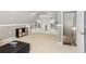 Finished attic space with built-in storage cabinets and shelves, creating a versatile and organized area at 2567 Briers North Dr, Dunwoody, GA 30360