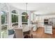 Bright eat-in kitchen with stainless steel appliances, white cabinets, and large arched windows at 2567 Briers North Dr, Dunwoody, GA 30360