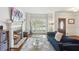 Living room showcasing a fireplace, hardwood floors, and large windows for ample natural light at 2567 Briers North Dr, Dunwoody, GA 30360