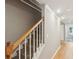 Carpeted staircase with white railings and hardwood floors, providing a classic and clean look at 2567 Briers North Dr, Dunwoody, GA 30360