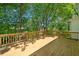 Spacious back deck made of wood, surrounded by beautiful, mature trees for extra privacy at 2682 Varner Dr, Atlanta, GA 30345