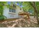 Stunning backyard featuring a wooden deck, a lush lawn, and beautiful trees offering plenty of shade at 2682 Varner Dr, Atlanta, GA 30345
