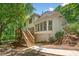 Expansive backyard showcases a wooden deck with stairs, a large patio, and mature landscaping at 2682 Varner Dr, Atlanta, GA 30345
