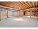 Unfinished basement with exposed wood beams and concrete floor, waiting for your design ideas at 2682 Varner Dr, Atlanta, GA 30345