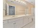 Bathroom with double vanity, large mirror, white cabinets, and a separate toilet and shower at 2682 Varner Dr, Atlanta, GA 30345