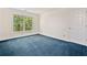 Relaxing bedroom with large window providing lots of light and blue carpet for comfort at 2682 Varner Dr, Atlanta, GA 30345