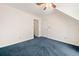 Finished bonus room with blue carpet, ceiling fan and a walk-in closet at 2682 Varner Dr, Atlanta, GA 30345